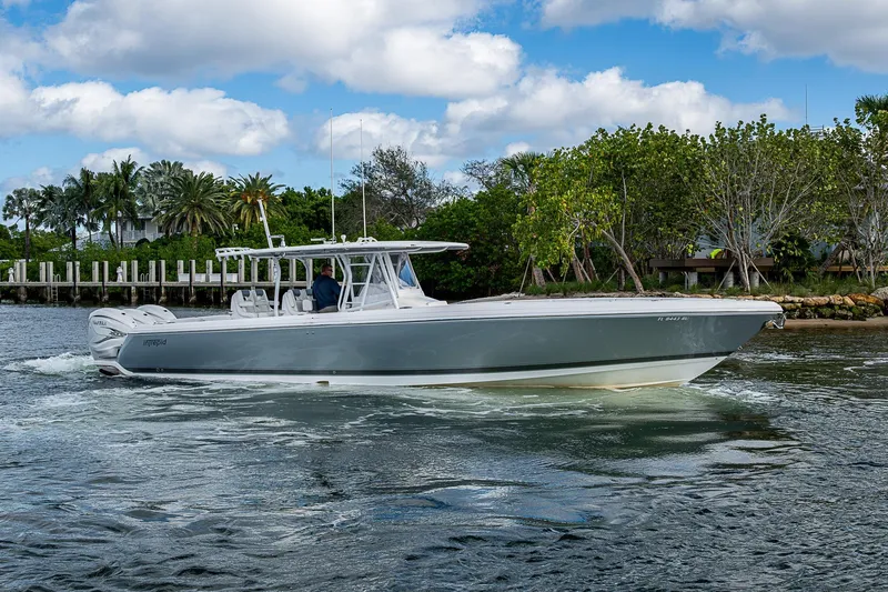  Yacht Photos Pics 2019 Intrepid 407 Nomad FE boat cruising on a scenic waterway.