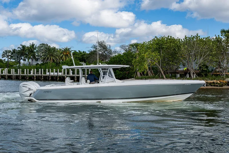  Yacht Photos Pics 2019 Intrepid 407 Nomad FE boat cruising on a scenic waterway.