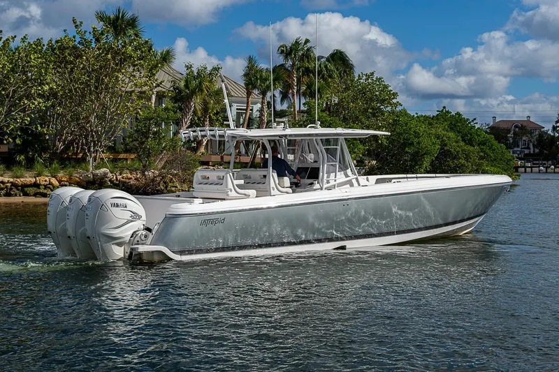  Yacht Photos Pics 2019 Intrepid 407 Nomad FE boat cruising on a scenic waterway.