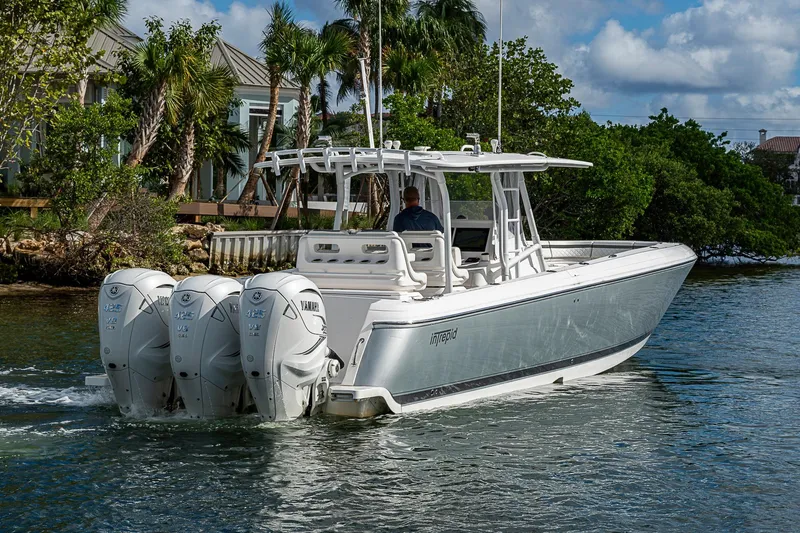  Yacht Photos Pics 2019 Intrepid 407 Nomad FE boat with triple Yamaha engines cruising on water.