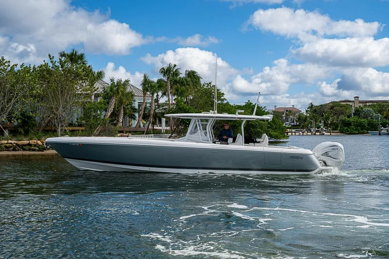  Yacht Photos Pics 2019 Intrepid 407 Nomad FE boat cruising on a scenic waterway.