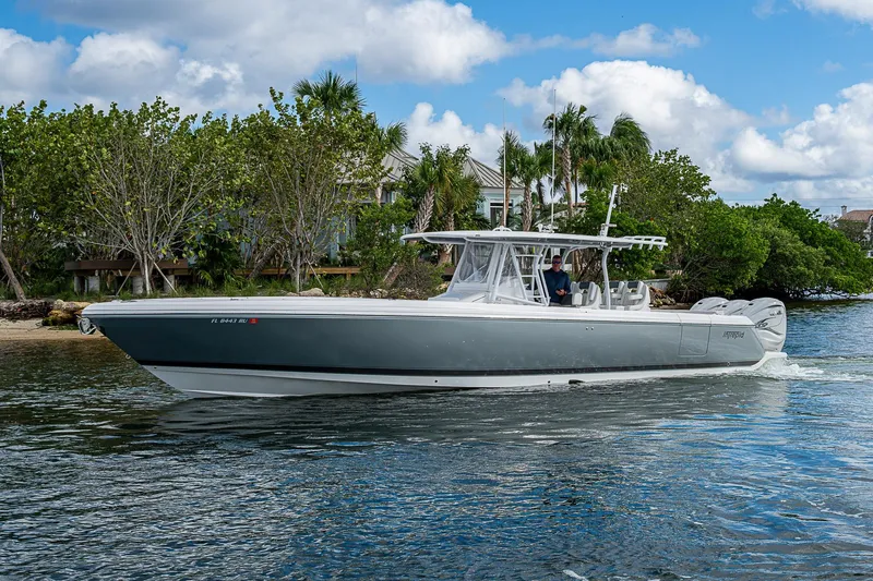  Yacht Photos Pics 2019 Intrepid 407 Nomad FE boat cruising on a scenic waterway.