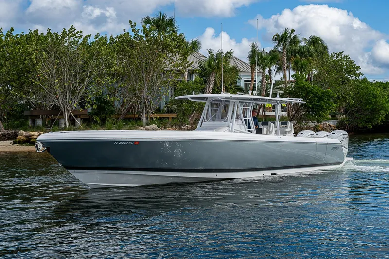  Yacht Photos Pics 2019 Intrepid 407 Nomad FE boat cruising on a scenic waterway.