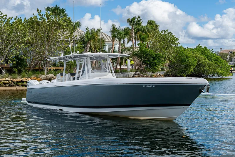  Yacht Photos Pics 2019 Intrepid 407 Nomad FE boat cruising on a scenic waterway.