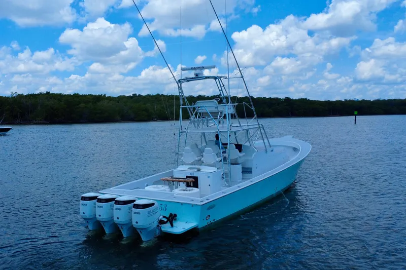 Highly Migratory Yacht Photos Pics 2017 Chesapeake 53 Center Console boat on water under blue sky.