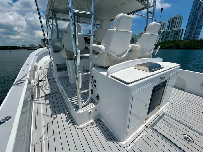 Highly Migratory Yacht Photos Pics 2017 Chesapeake 53 Center Console boat with sleek design and modern seating.