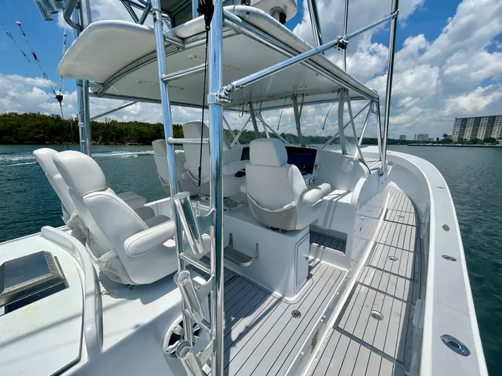 Highly Migratory Yacht Photos Pics 2017 Chesapeake 53 Center Console boat with sleek design and modern seating on open water.