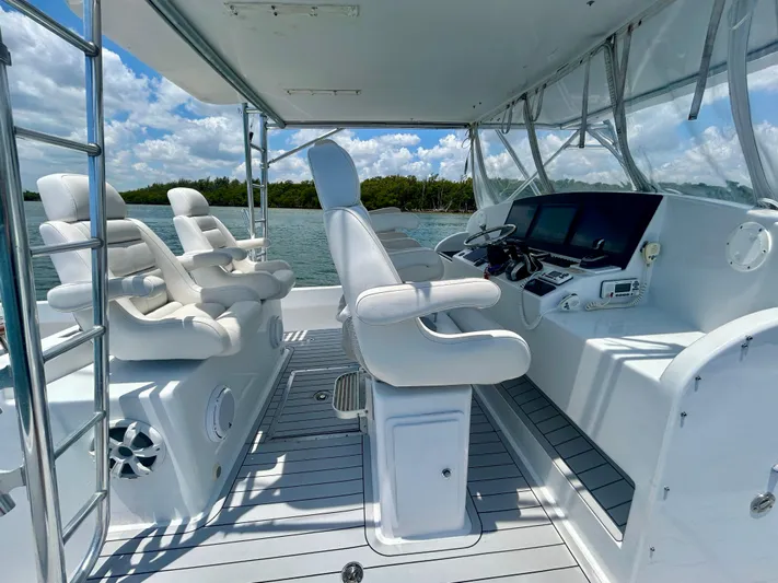 Highly Migratory Yacht Photos Pics 2017 Chesapeake 53 Center Console boat interior with helm, seats, and navigation equipment.