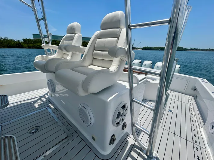 Highly Migratory Yacht Photos Pics 2017 Chesapeake 53 Center Console boat with white seating and ocean backdrop.