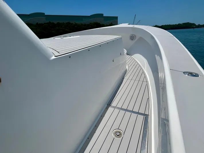 Highly Migratory Yacht Photos Pics 2017 Chesapeake 53 Center Console boat deck with sleek white design and ocean backdrop.
