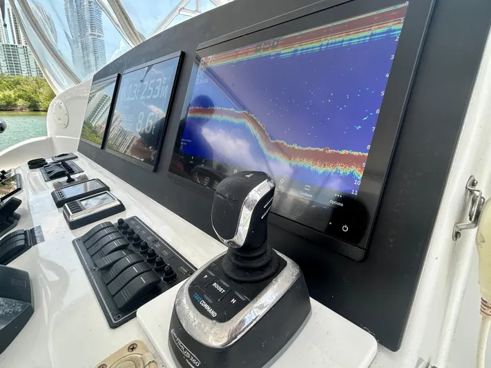 Highly Migratory Yacht Photos Pics 2017 Chesapeake 53 Center Console dashboard with navigation screens and controls.