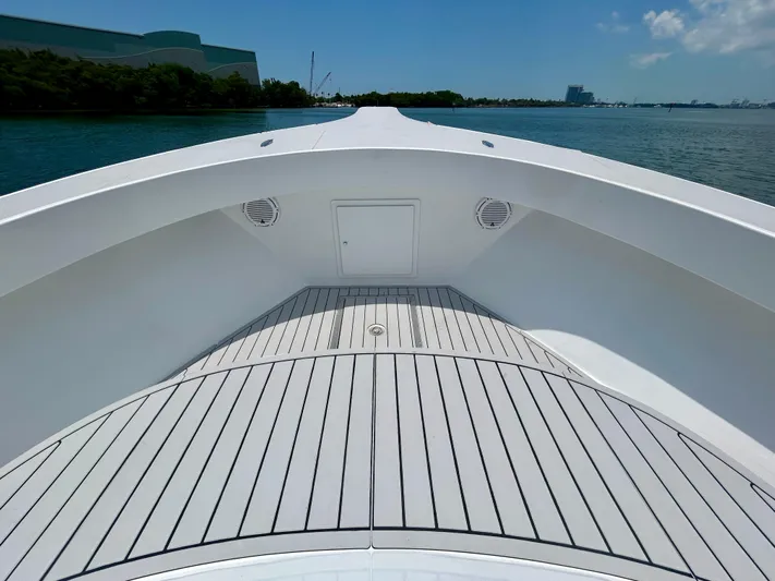 Highly Migratory Yacht Photos Pics 2017 Chesapeake 53 Center Console boat deck with sleek design on calm water.