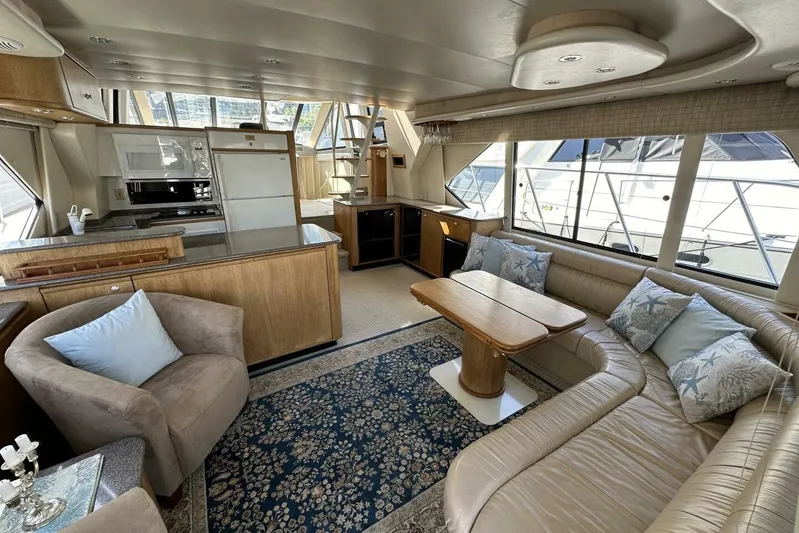 Yacht Photos Pics Luxurious interior of 2000 Bayliner 5288 Pilot House Motoryacht with elegant seating and decor.