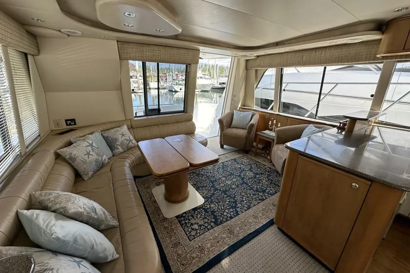  Yacht Photos Pics Luxurious interior of 2000 Bayliner 5288 Pilot House Motoryacht with elegant seating and decor.