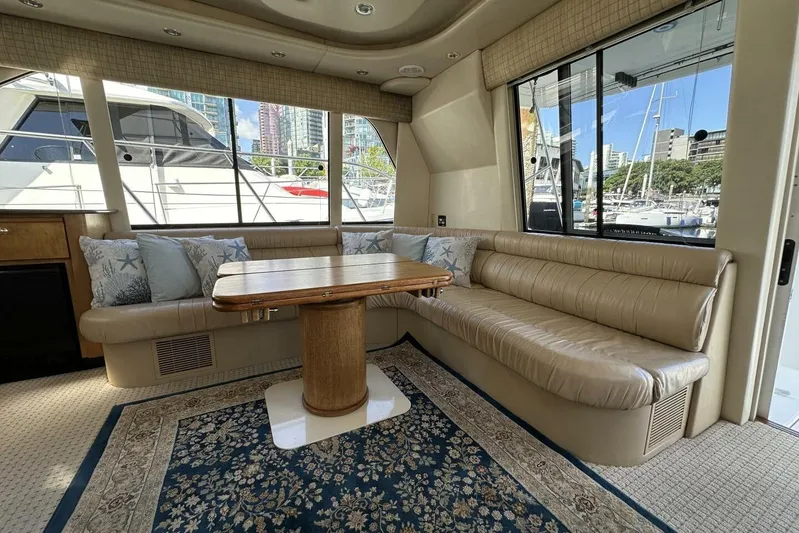  Yacht Photos Pics Luxurious interior of 2000 Bayliner 5288 Pilot House Motoryacht with plush seating and elegant decor.