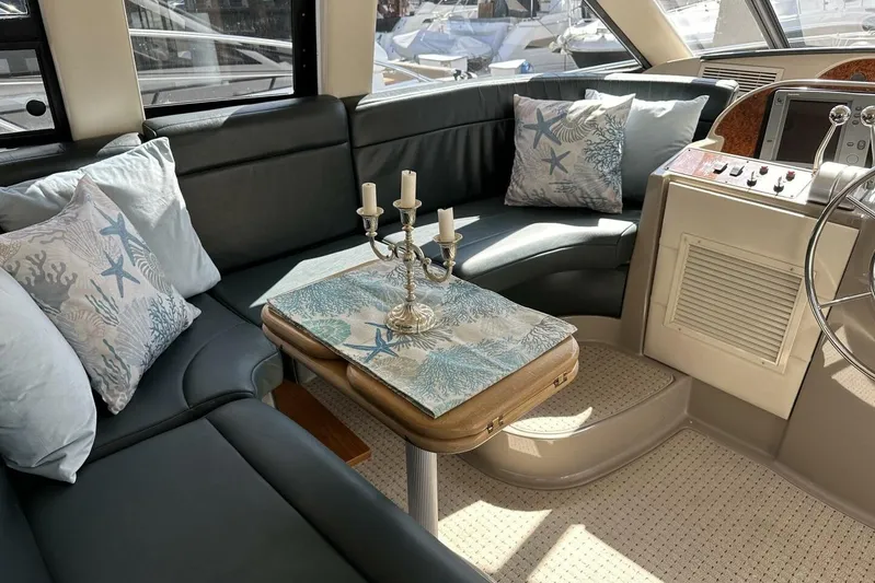  Yacht Photos Pics Luxurious interior of 2000 Bayliner 5288 Pilot House Motoryacht with elegant seating and decor.