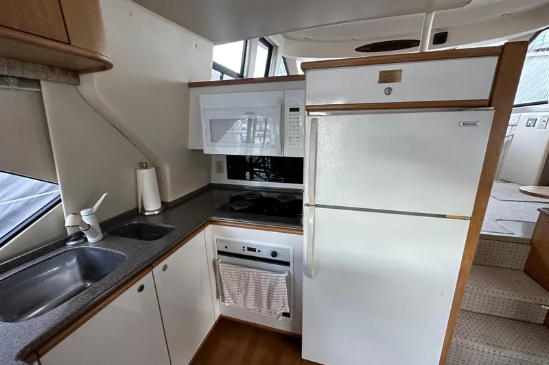  Yacht Photos Pics 2000 Bayliner 5288 Pilot House Motoryacht kitchen with modern appliances and sleek design.