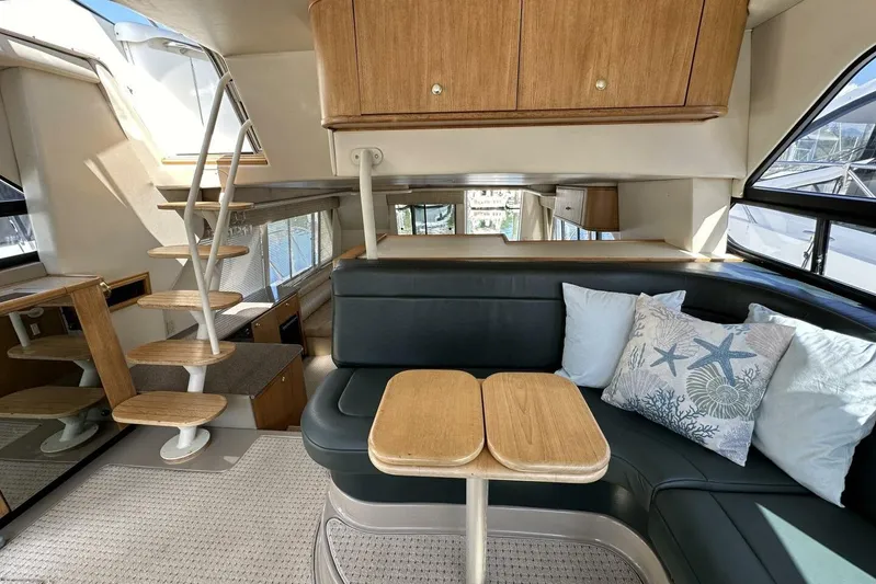  Yacht Photos Pics Luxurious interior of 2000 Bayliner 5288 Pilot House Motoryacht with elegant seating and wooden accents.