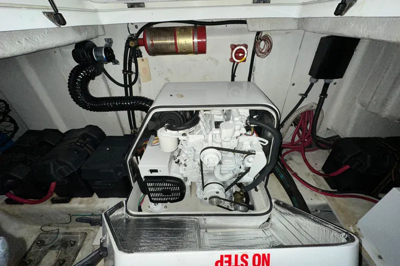  Yacht Photos Pics Engine room of 2000 Bayliner 5288 Pilot House Motoryacht with visible machinery and wiring.