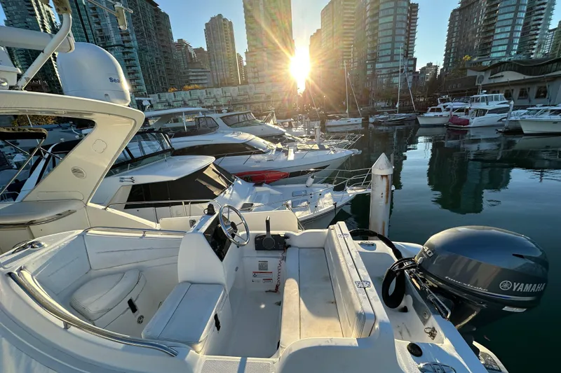  Yacht Photos Pics Bayliner 5288 Pilot House Motoryacht, 2000, docked in a marina at sunset.