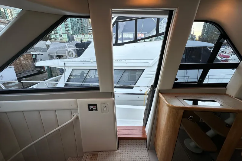  Yacht Photos Pics Interior view of a 2000 Bayliner 5288 Pilot House Motoryacht, showing docked yachts outside.