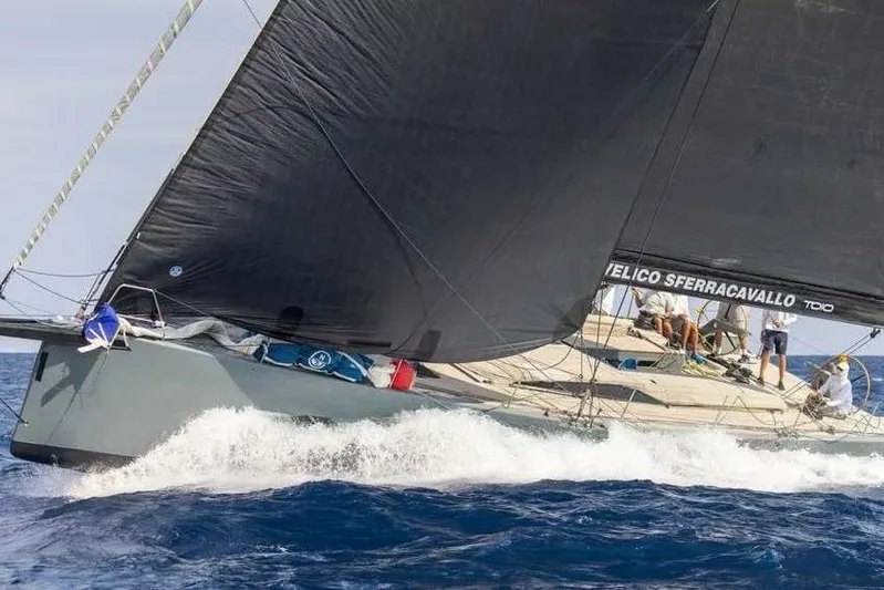 Manticore Yacht Photos Pics Sailing yacht Mylius 60, 2019 model, cutting through ocean waves with black sails.