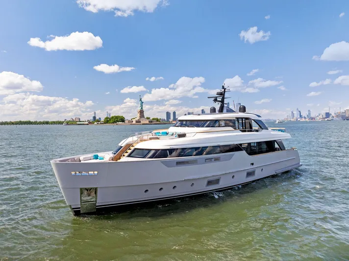 Don't Tell Mom Yacht Photos Pics Sanlorenzo SD96 2021 yacht cruising near the Statue of Liberty on a sunny day.