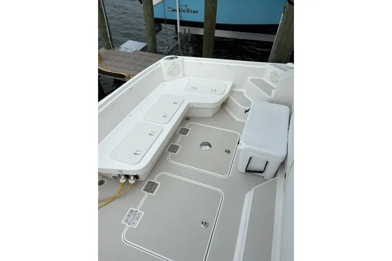  Yacht Photos Pics 2013 Back Cove 34 boat deck with seating and storage compartments.
