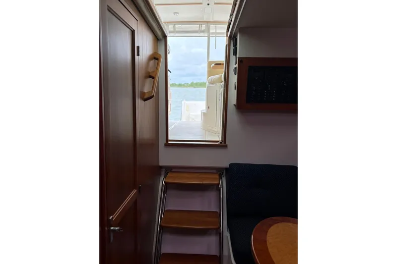  Yacht Photos Pics Interior view of 2013 Back Cove 34 yacht, featuring wooden stairs and cabin details.