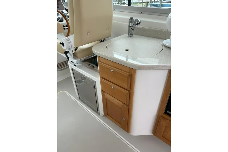  Yacht Photos Pics 2013 Back Cove 34 interior with sink, storage drawers, and seating.