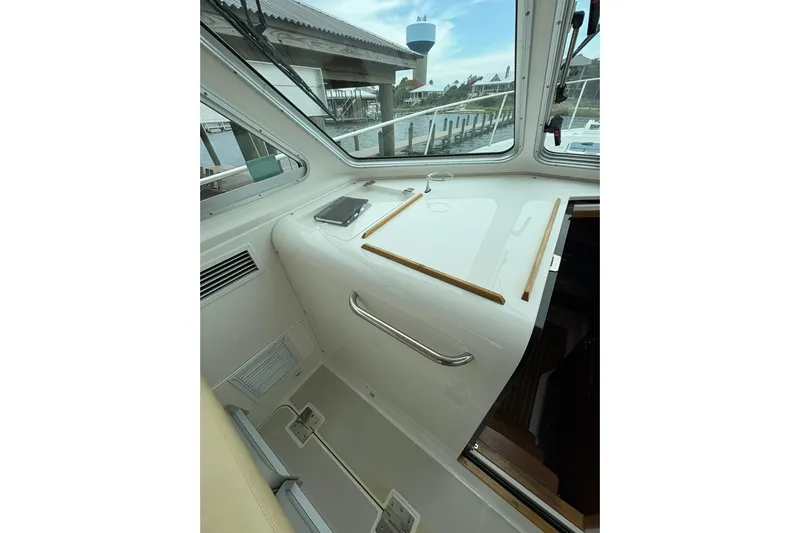  Yacht Photos Pics 2013 Back Cove 34 boat interior with sleek design and waterfront view.