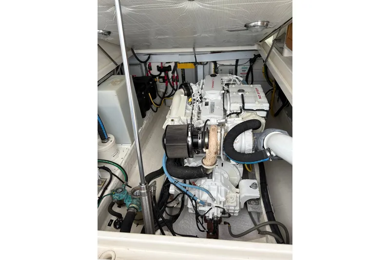  Yacht Photos Pics Engine compartment of a 2013 Back Cove 34 boat, showcasing detailed mechanical components.