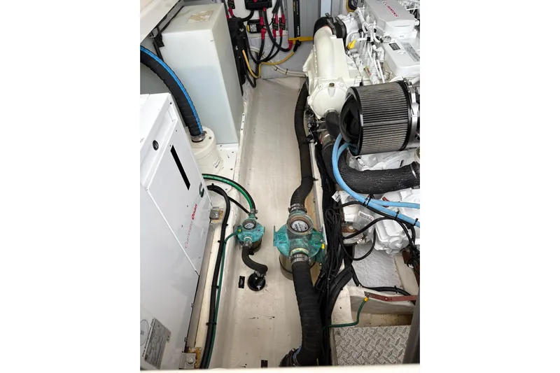  Yacht Photos Pics Engine compartment of a 2013 Back Cove 34 boat, showcasing mechanical components and wiring.