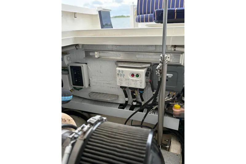  Yacht Photos Pics Engine compartment of a 2013 Back Cove 34 boat, showcasing control panels and wiring.