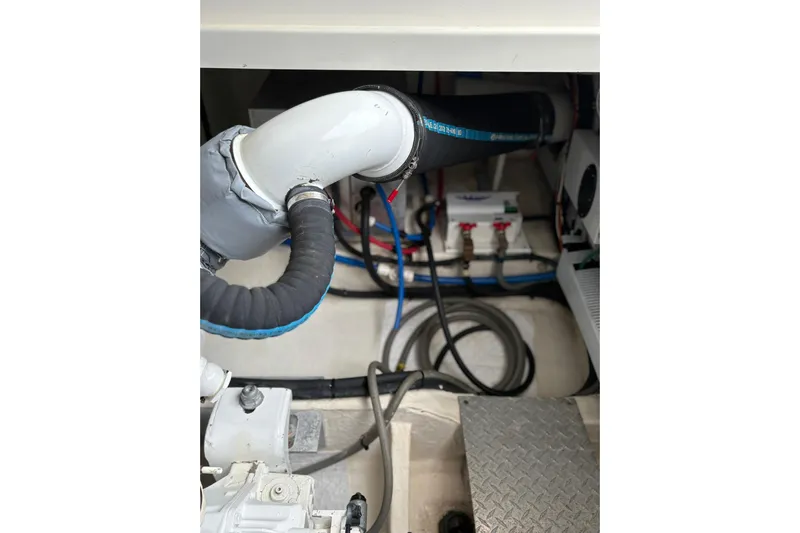  Yacht Photos Pics Engine compartment of a 2013 Back Cove 34 boat, showing hoses and mechanical components.