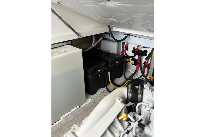  Yacht Photos Pics Engine compartment of a 2013 Back Cove 34 boat, showing battery and wiring setup.