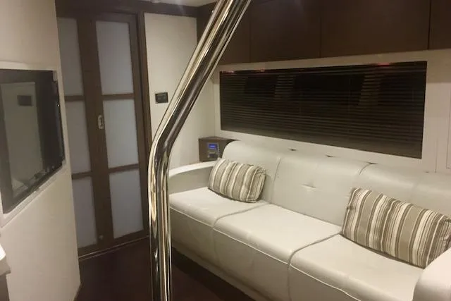  Yacht Photos Pics Luxurious interior of 2014 Sea Ray 410 Sundancer yacht with white leather seating.