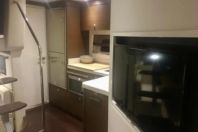  Yacht Photos Pics Interior of 2014 Sea Ray 410 Sundancer yacht with modern kitchen amenities.