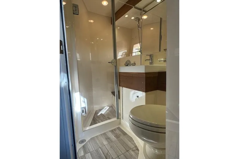  Yacht Photos Pics Bathroom interior of 2014 Sea Ray 410 Sundancer yacht with shower and toilet.