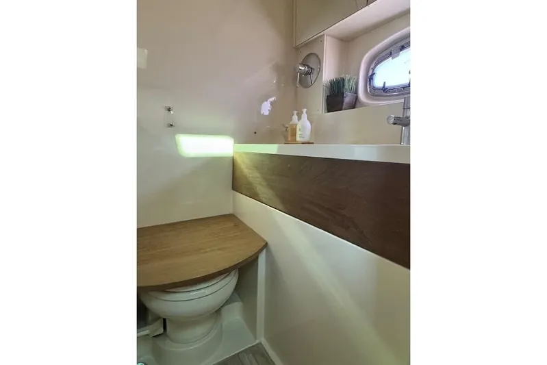  Yacht Photos Pics Bathroom interior of 2014 Sea Ray 410 Sundancer yacht, featuring modern design and wooden accents.