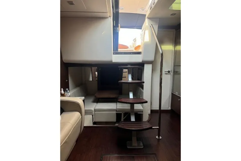  Yacht Photos Pics Interior of 2014 Sea Ray 410 Sundancer yacht with modern staircase and seating area.