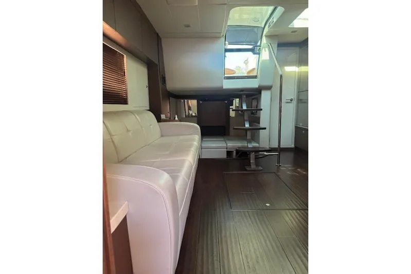  Yacht Photos Pics Interior of 2014 Sea Ray 410 Sundancer yacht with modern seating and wooden flooring.