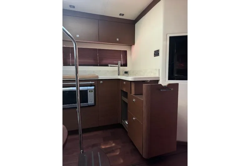  Yacht Photos Pics Luxurious kitchen interior of 2014 Sea Ray 410 Sundancer yacht with modern amenities.