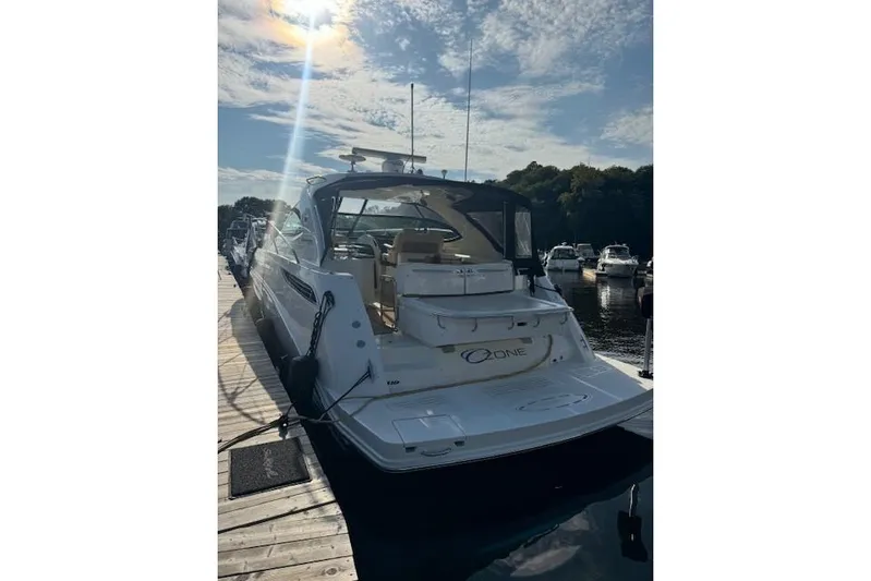  Yacht Photos Pics 2014 Sea Ray 410 Sundancer yacht docked under a sunny sky.