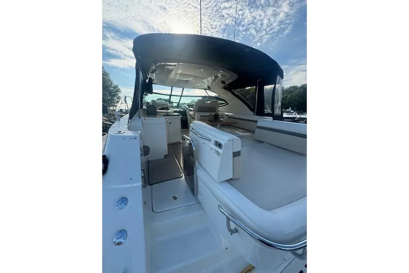  Yacht Photos Pics 2014 Sea Ray 410 Sundancer yacht interior with seating, under a clear blue sky.