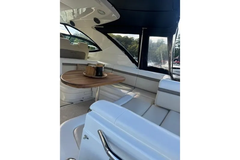  Yacht Photos Pics Luxurious interior of 2014 Sea Ray 410 Sundancer yacht with elegant seating and table.