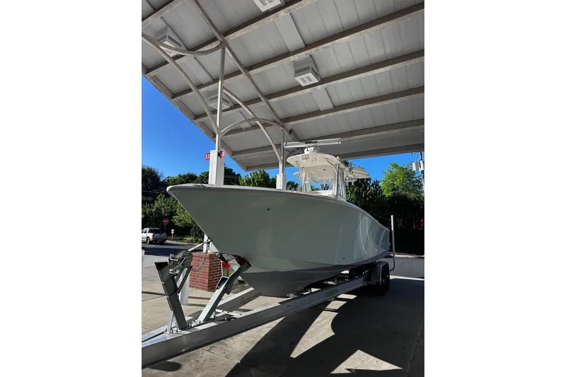Engel-sea Yacht Photos Pics 2014 SeaVee 290B boat on trailer under a canopy, sunny day.