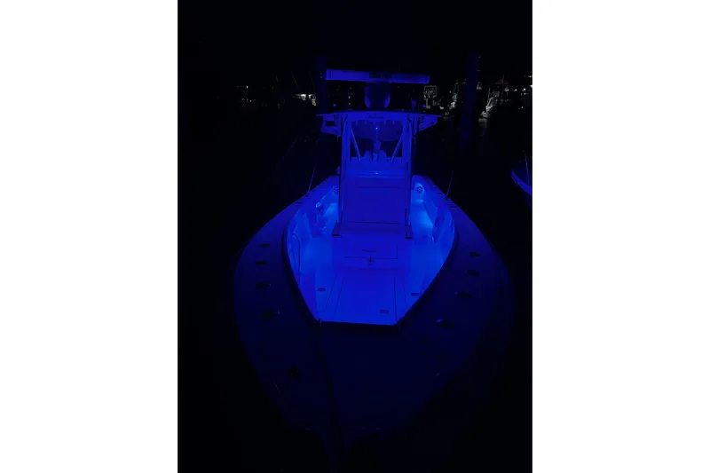 Engel-sea Yacht Photos Pics 2014 SeaVee 290B boat illuminated with blue lights at night.