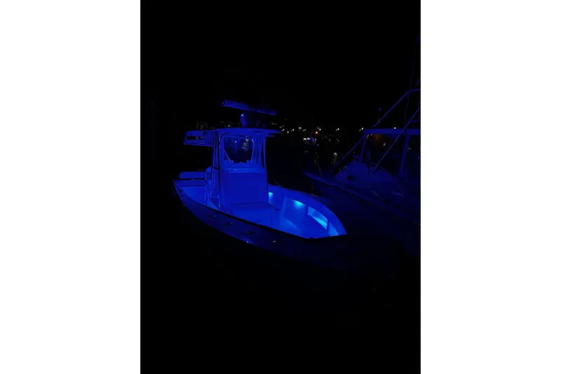 Engel-sea Yacht Photos Pics 2014 SeaVee 290B boat illuminated with blue lights at night.