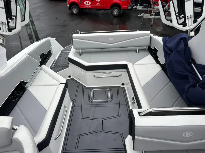  Yacht Photos Pics 2022 Cobalt R8 Surf boat interior with gray seating and sleek design.